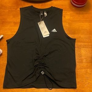 Adidas small black tank top, never worn tag still on.